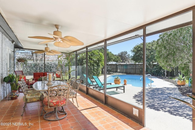 sunroom / solarium with ceiling fan