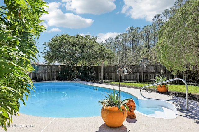 view of pool featuring a fenced in pool and a fenced backyard