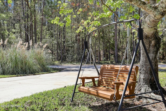 view of home's community featuring a forest view