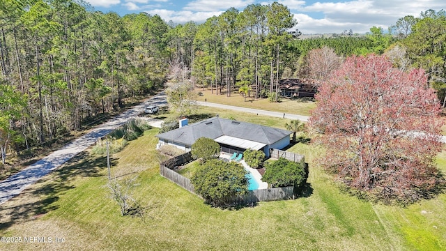 bird's eye view featuring a forest view