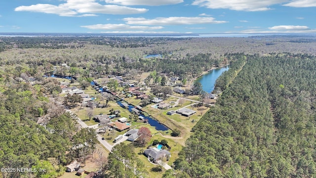 aerial view featuring a view of trees and a water view