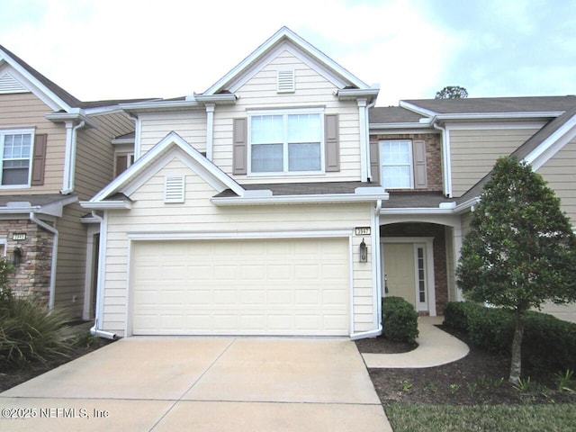 view of front of home with an attached garage and driveway