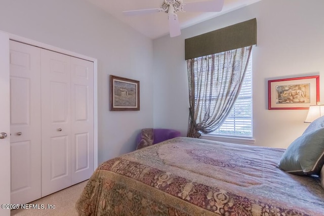 carpeted bedroom with a closet and ceiling fan