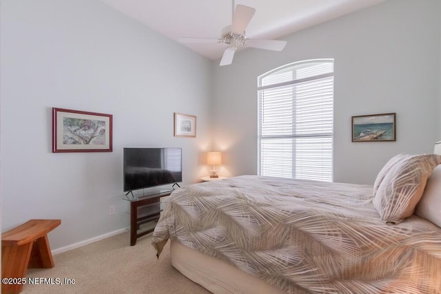 bedroom featuring baseboards, multiple windows, ceiling fan, and carpet flooring