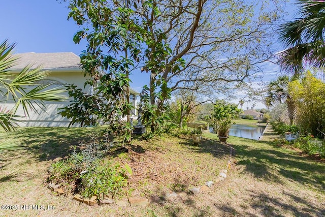 view of yard with a water view