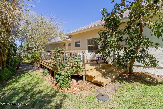 view of yard featuring a wooden deck