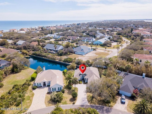 birds eye view of property featuring a residential view and a water view