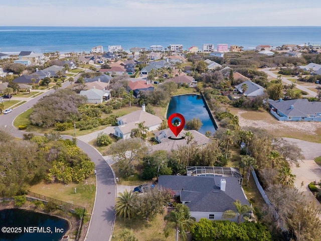 birds eye view of property featuring a water view and a residential view