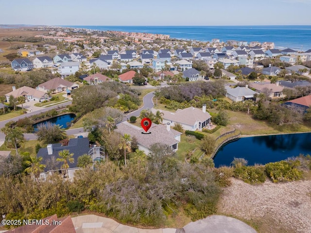 aerial view with a residential view and a water view