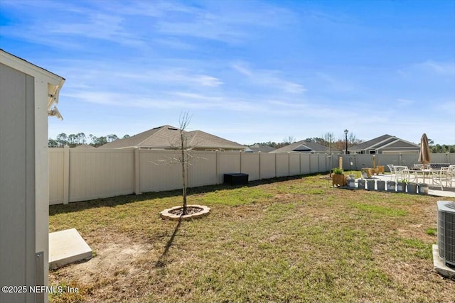 view of yard with a patio and a fenced backyard