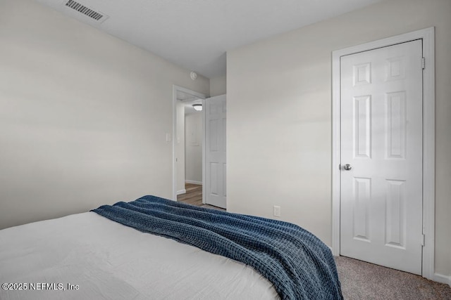 bedroom with carpet and visible vents