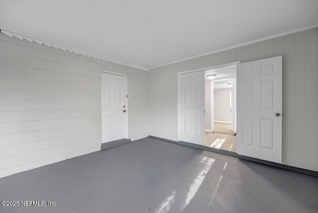 spare room featuring finished concrete flooring