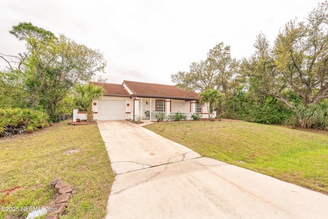 ranch-style house featuring a front yard, driveway, covered porch, a garage, and a tile roof