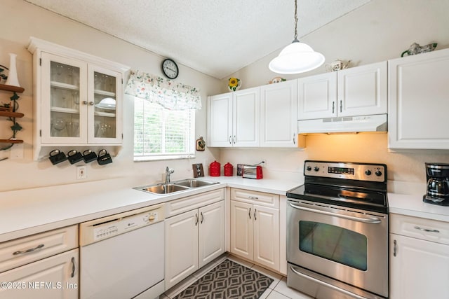 kitchen with under cabinet range hood, light countertops, stainless steel range with electric cooktop, white dishwasher, and a sink