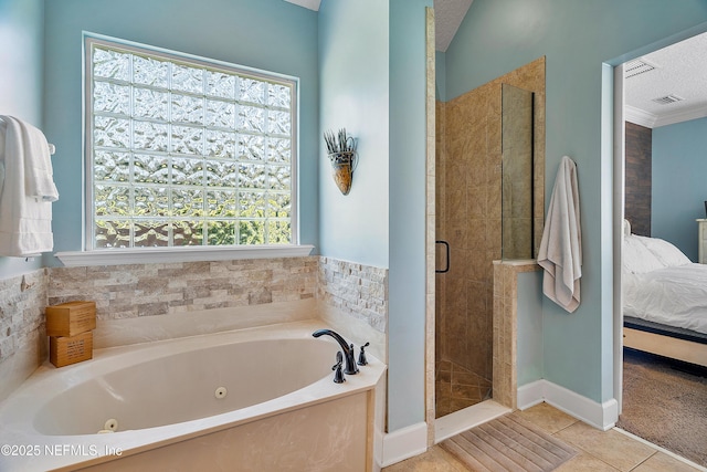 bathroom featuring tile patterned flooring, a shower stall, a textured ceiling, a jetted tub, and connected bathroom