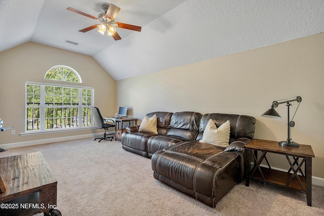 living room with visible vents, baseboards, vaulted ceiling, carpet floors, and a textured ceiling