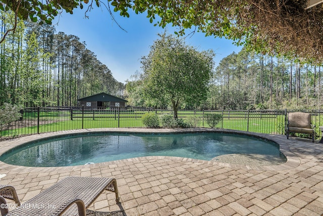 view of pool featuring a patio area, a fenced in pool, a yard, and fence