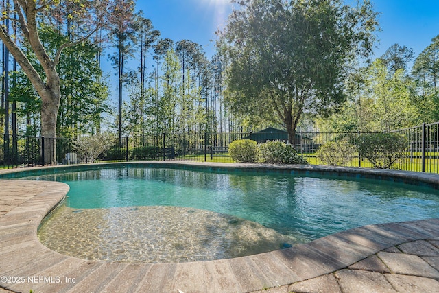 view of swimming pool featuring a fenced in pool and a fenced backyard