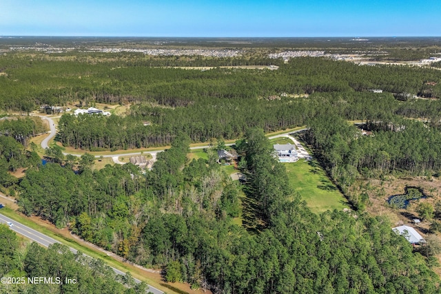 aerial view with a wooded view