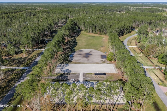 aerial view with a wooded view