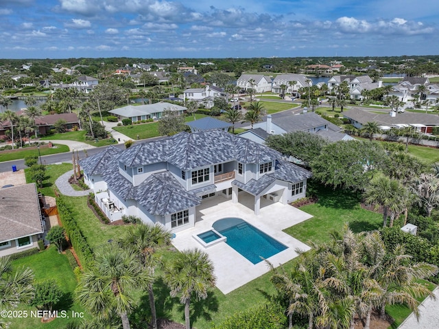 birds eye view of property with a residential view