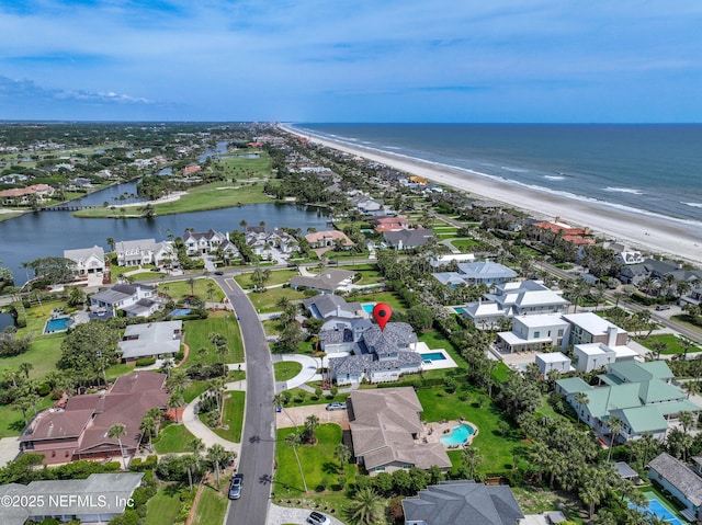 bird's eye view featuring a water view, a residential view, and a view of the beach