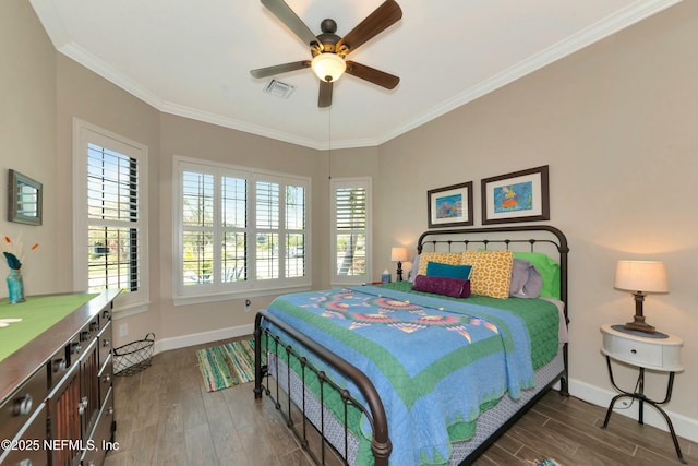 bedroom with visible vents, crown molding, dark wood-type flooring, and baseboards