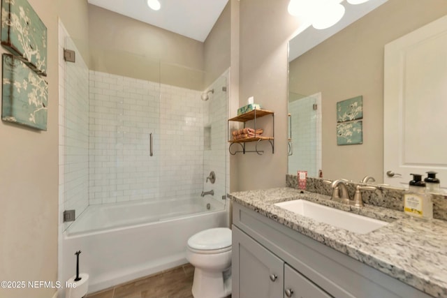 full bath featuring vanity, bathing tub / shower combination, and toilet