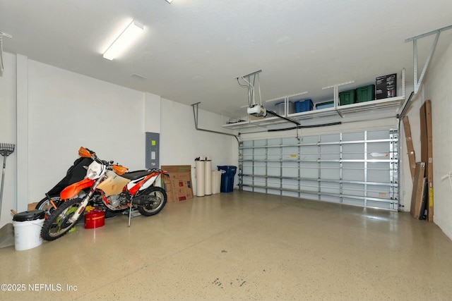 garage with electric panel and a garage door opener