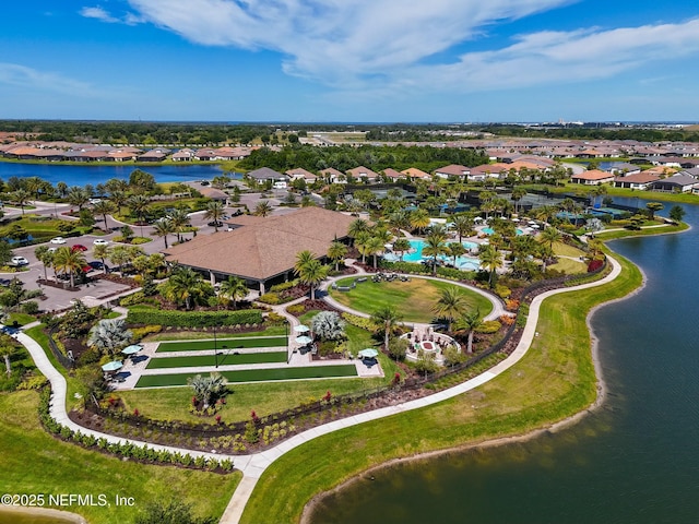 bird's eye view featuring a residential view and a water view