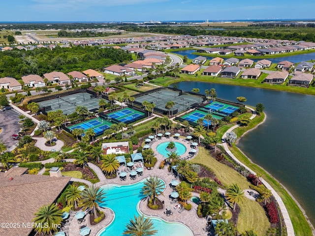 aerial view with a residential view and a water view