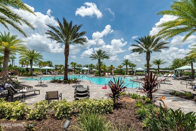 community pool featuring a gazebo and a patio area