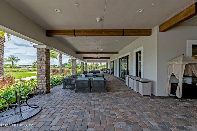 view of patio / terrace with ceiling fan and outdoor dining space