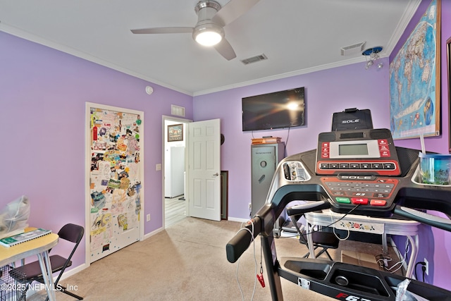 exercise room with visible vents, carpet, and crown molding