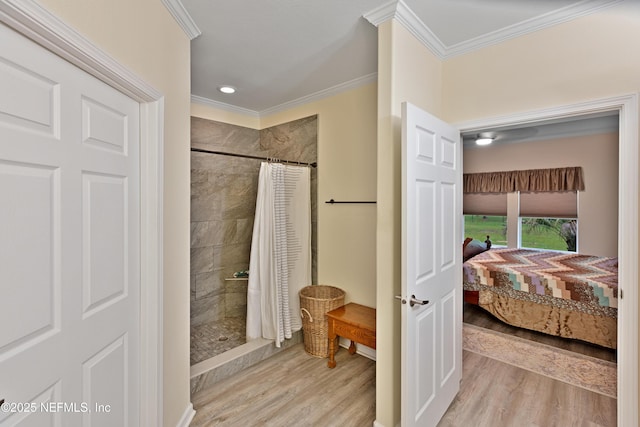 full bathroom with wood finished floors, ensuite bathroom, and crown molding