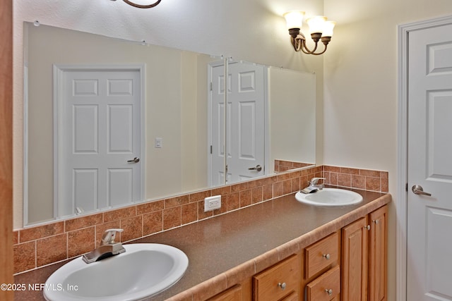 bathroom with double vanity, decorative backsplash, and a sink