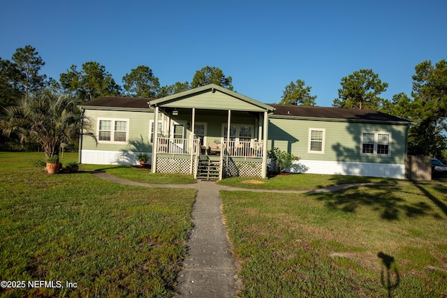 manufactured / mobile home with a porch and a front yard