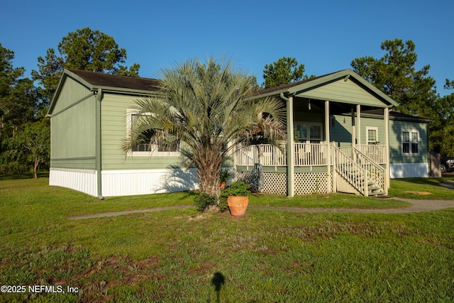 manufactured / mobile home with a porch and a front lawn