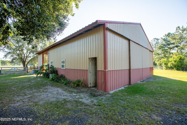 exterior space featuring a lawn and fence