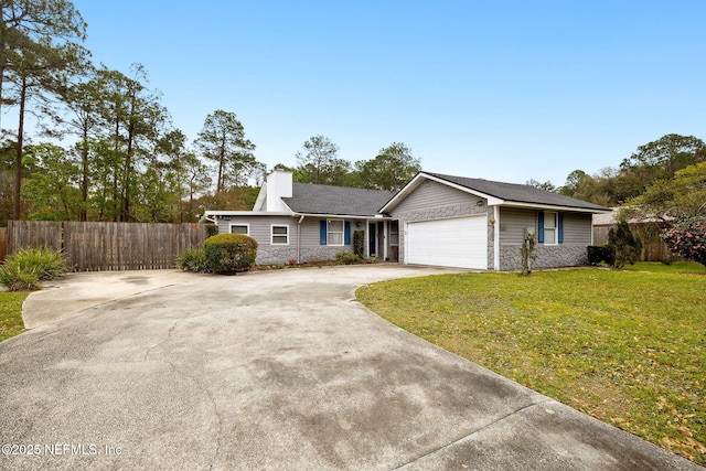 ranch-style house featuring a front lawn, fence, stone siding, and driveway