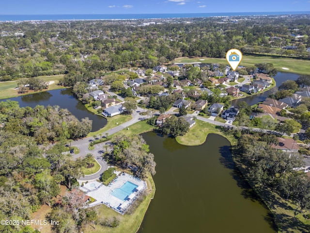 birds eye view of property with a water view and a residential view