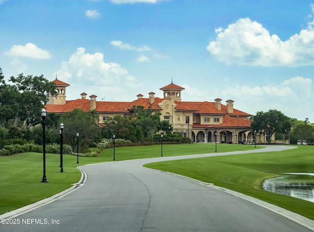 view of home's community featuring a lawn