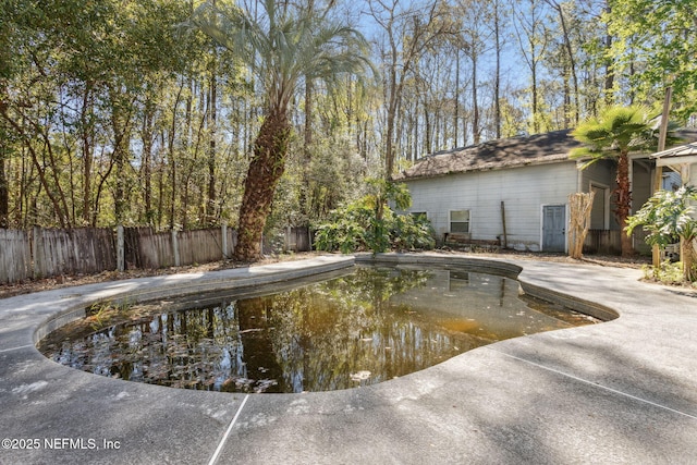 view of pool with fence