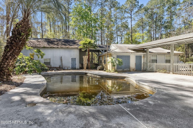 view of pool with fence