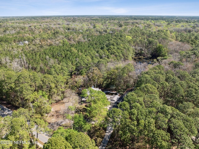 aerial view featuring a view of trees