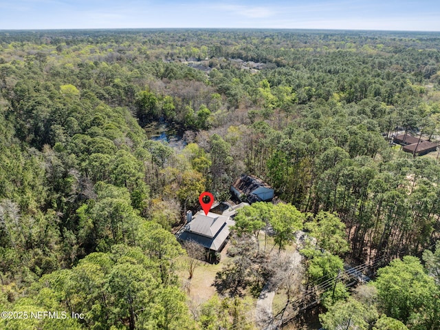 bird's eye view featuring a view of trees