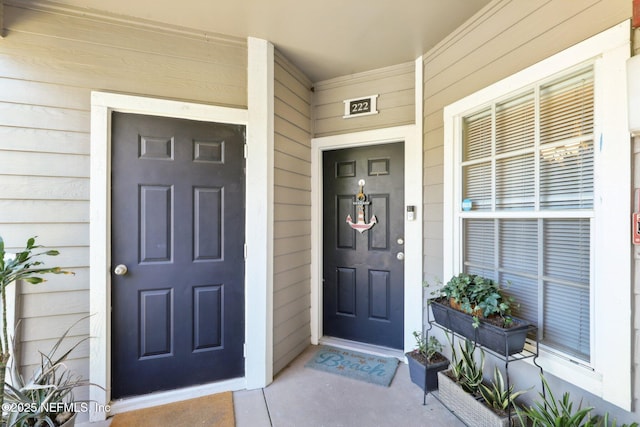 doorway to property with a porch