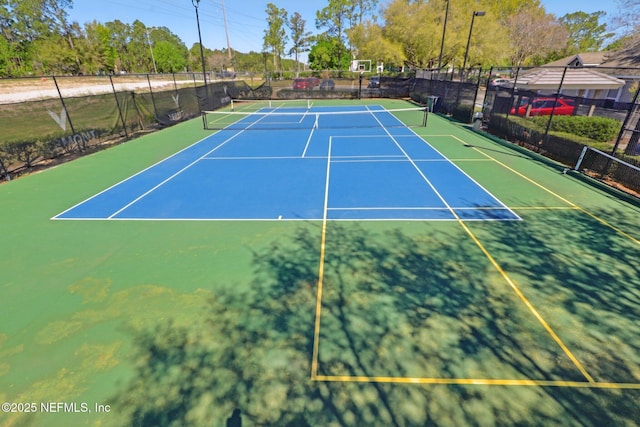 view of sport court with community basketball court and fence