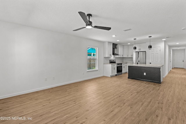 unfurnished living room featuring visible vents, baseboards, light wood-type flooring, a textured ceiling, and a ceiling fan