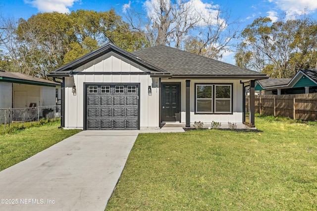 view of front of home featuring board and batten siding, an attached garage, a front lawn, and fence